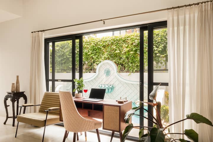 Ground Floor: Living Area with workstation facing the pool