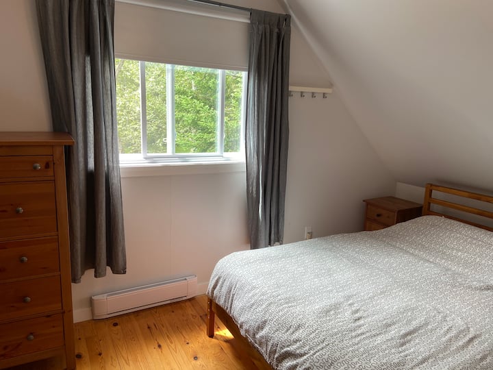 Upstairs bedroom including 1 queen bed (nb, bedding is excluded).
