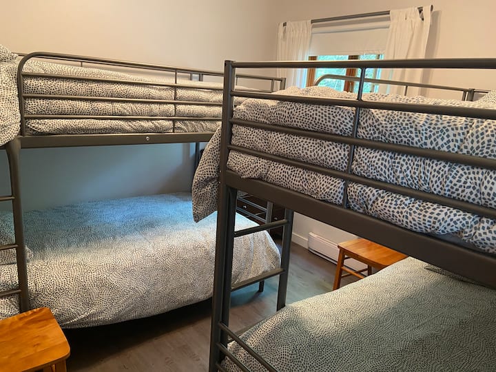 Total of 4 single beds (nb, bedding is excluded). Located on the ground floor next to the bathroom. Reading books for the kids.