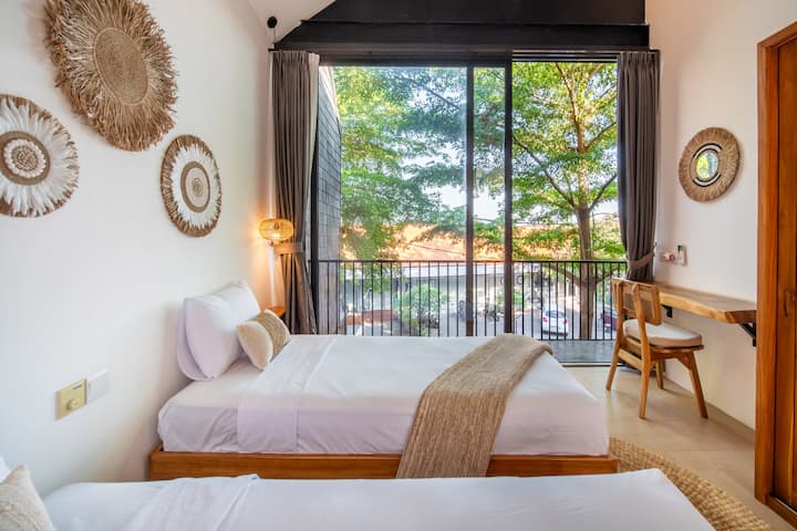 Step into a sun-kissed villa haven! Unique twin beds, chic decor, and thoughtful touches create a cozy escape. Welcome to your stylish home away from home!