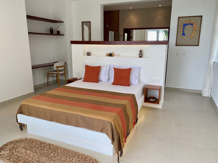 Quarto indigeno no terreo com vista ao mar