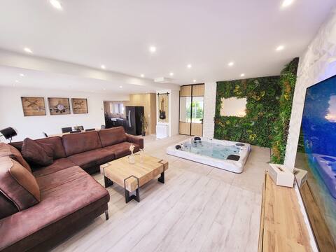 Modern stone longhouse with indoor hot tub