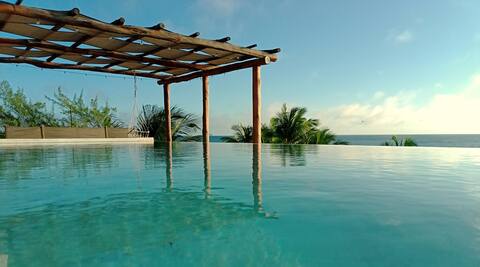 Beachfront villa in front of the sea