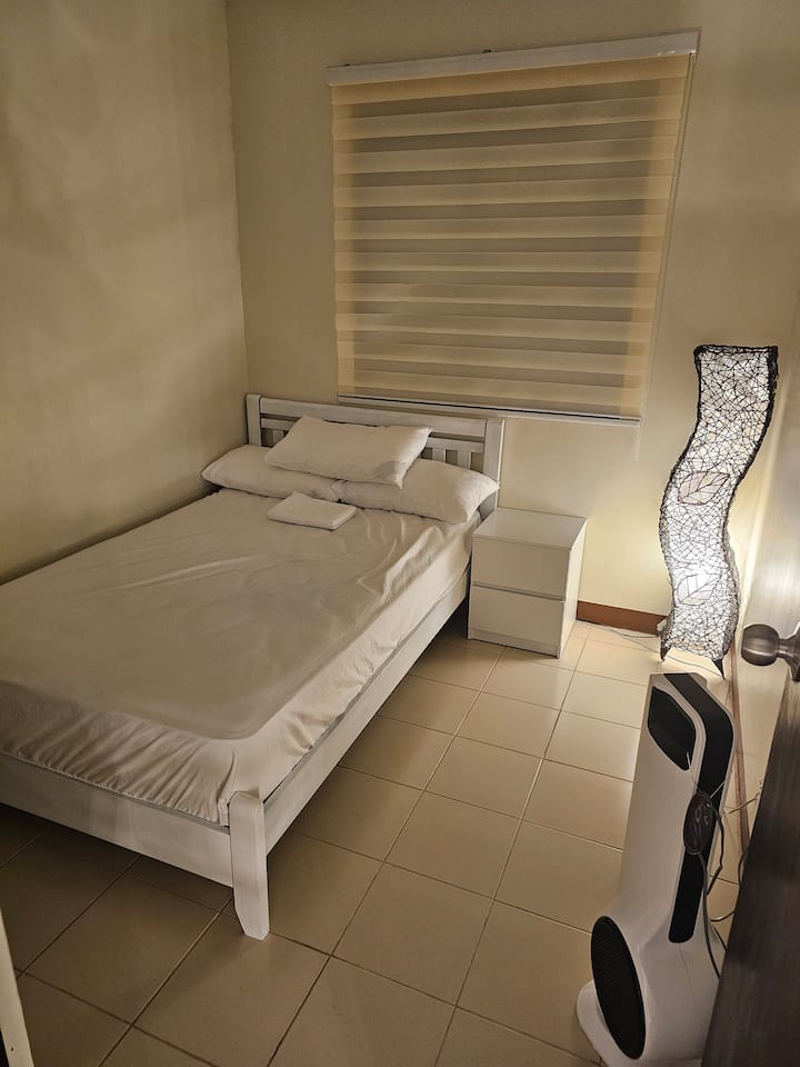Double size bed with a dedicated TV—perfect for winding down after exploration or business, or simply unwinding before bedtime for a comfortable and relaxing stay!