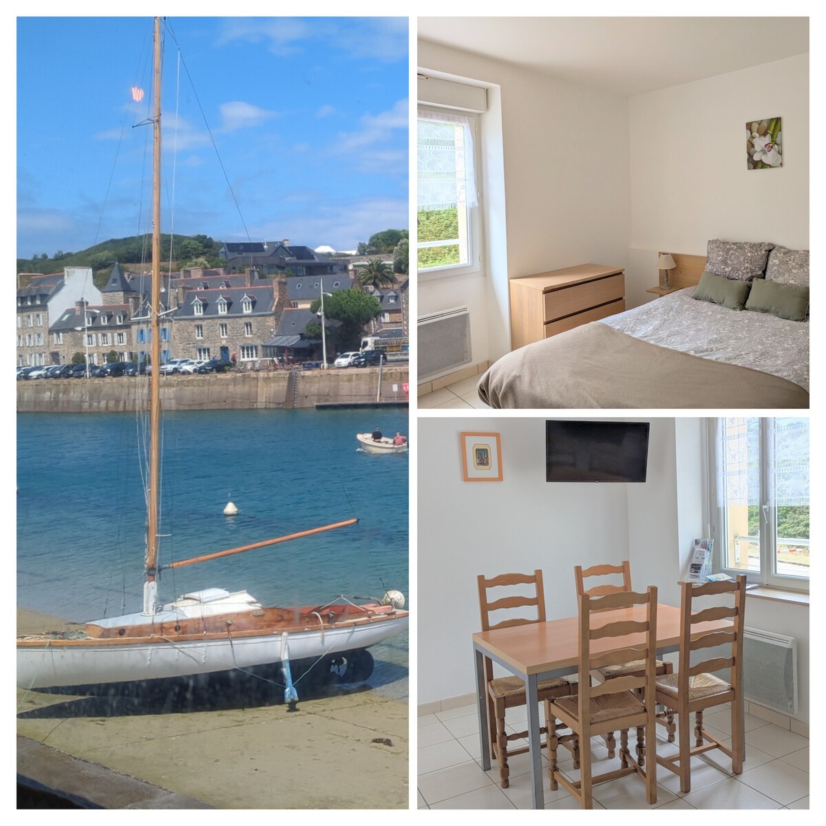 A sailboat is anchored in calm waters, with a backdrop of a charming coastal village. A cozy bedroom features a neatly made bed adorned with light bedding. A dining area includes a simple table with four wooden chairs, complemented by a wall-mounted TV.