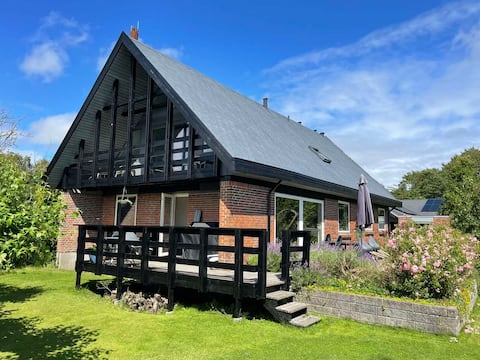 Large house with activity room and trampoline in the garden
