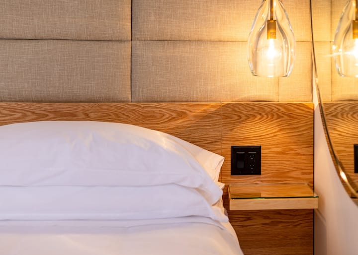 King size bed | Smart tech touches | USBC/A bedside ports | Alarm clock with MagSafe charging | Privacy, black out shades. "Everything was impeccably clean, peaceful, and extremely comfortable" -Elizabeth, April 2025