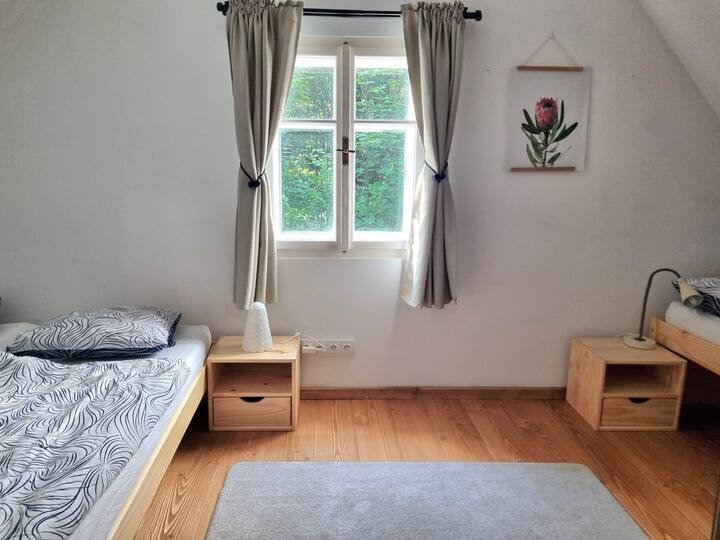 Bedroom 2 includes a king size bed, single bed, bedside tables and a floor mattress 