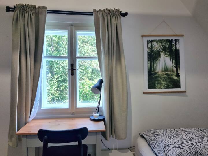 Bedroom 1  includes a king size bed, single bed, pull-out single bed, chest of drawers/baby change table, desk and floor mattress 