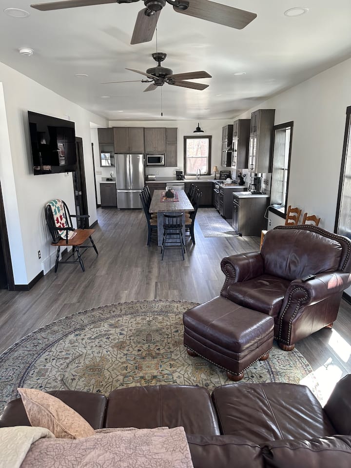 Large open living area with 60" OLED Smart TV for our guest's viewing pleasure.  This area has room for the full sized air bed should anyone prefer to sleep on the main level.