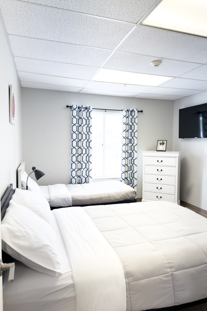 Bedroom 4 is complete with a full bed and a single bed. This bedroom has an attached full size bathroom that is accessible from both the bedroom and hallway. 