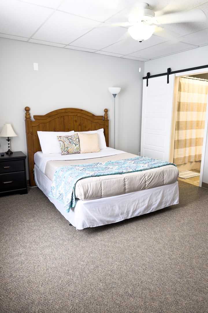 This is the first of two master suites. Both master suites have a queen bed, tv, and attached ensuite bathroom and closet. 