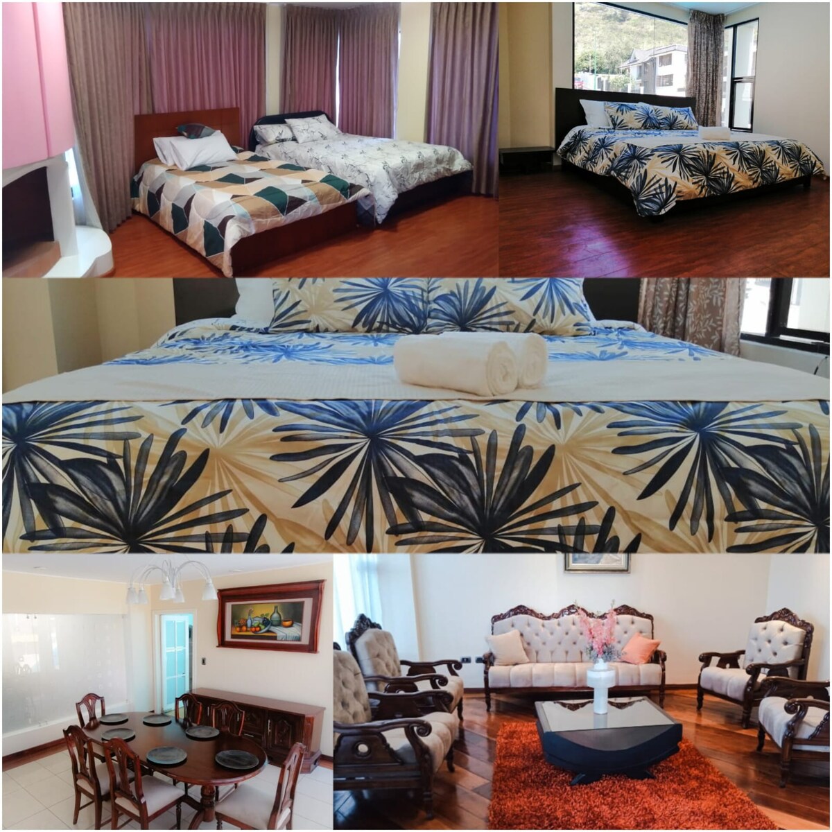 A comfortable sleeping area features two spacious beds, each with distinct patterned beddings and ample natural light from large windows. A dining area displays an elegant table set for six, complemented by classic chairs and tasteful decor, fostering a welcoming atmosphere.