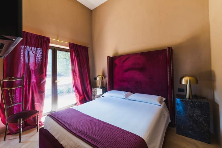 Villa Es purple bedroom