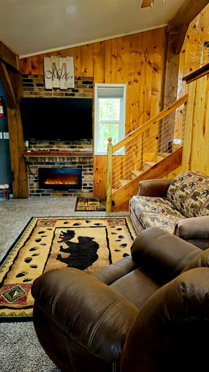 Authentic reclaimed wooden beams overhead  add to the charm of this cozy cabin.  58" Roku Smart TV so you can watch live TV or sign into your own streaming services with our free high speed fiber internet. 