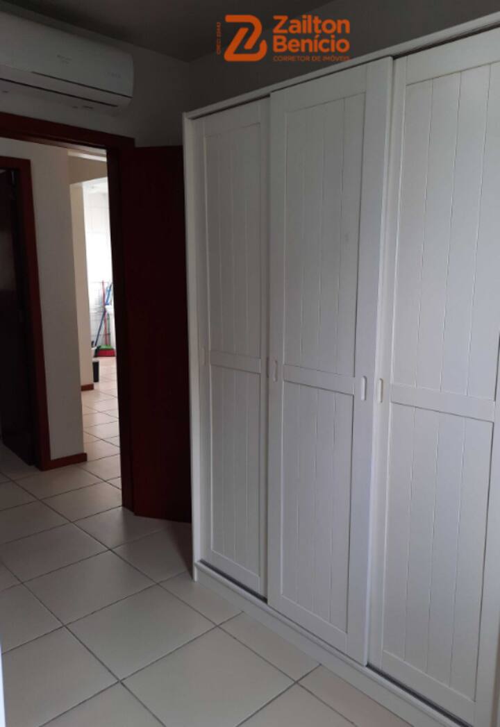 Room wardrobes that contain a bunk bed and an extra mattress. 