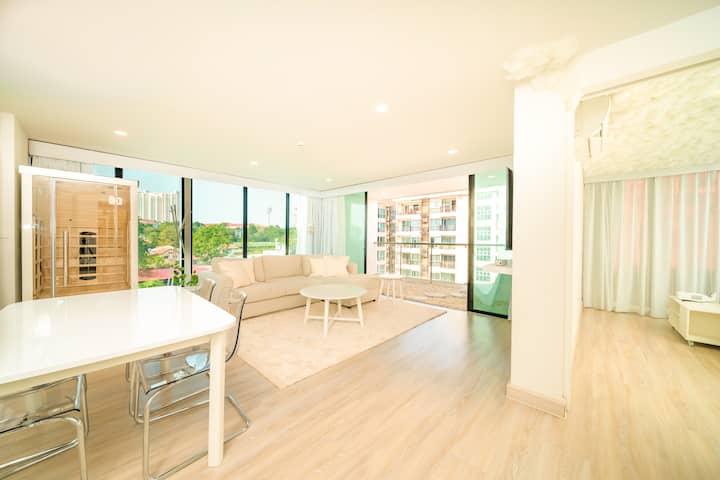 This spacious living room offers a clean, serene ambiance with plenty of natural light and an open layout. Neutral tones and modern finishes create a bright, inviting space perfect for both relaxation and entertaining.