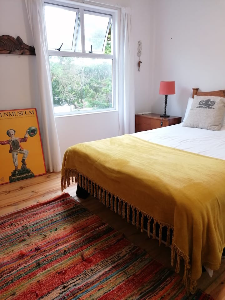 First floor bedroom ( upstairs ). Located on the south side. Has one window, facing south. 