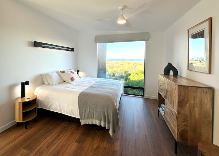 Bedroom One (Seaview Room)- this room has the sea view facing east- wake up to the sunrise, or close the Roman blind and sleep in until noon. Super-king, super comfortable.