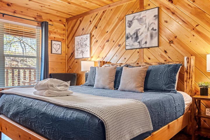 Enjoy a peaceful night's sleep in our 1st master with a comfortable King bed. This room boasts a beautiful view of the front porch and trees, and has a 55" Roku TV. Right off this master is our "Cozy Cub Cave" bunk room to keep your cubs close by.