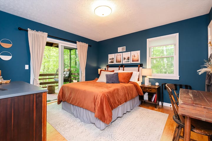 Bedroom #1 on the first floor is a VIBE. Not only is it super-cozy and chic, you are also mere steps away from being outside and relaxing in the hanging egg chair amongst the trees.