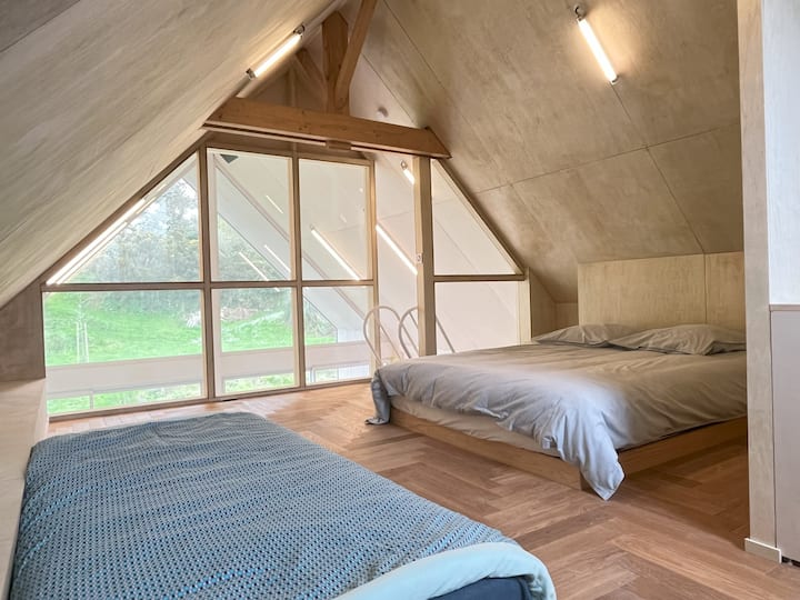 Dorm areas with beautiful view of the park. No doors or curtains. A toilet area with a wash basin. Access from the stay by a very steep staircase.