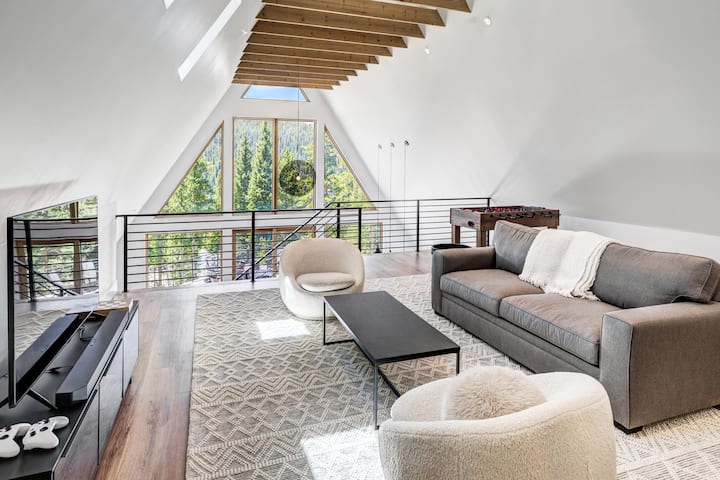 Lounge or play in style! Foosball, Arcade and XBox with streaming, large screen 50" TV.  Custom pull out sofa from Pottery Barn.