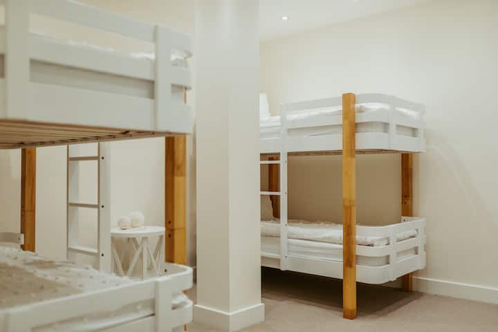 Four single beds with lovely linen awaits.