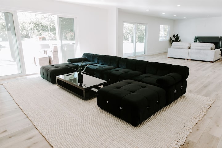 Relax in modern luxury on our comfortable couch, the perfect spot to unwind after a day of Hollywood adventures. With a 65-inch TV, your entertainment awaits in style. Welcome home to contemporary comfort and relaxation. ️✨ #ModernLiving