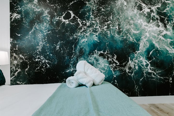 Escape to coastal bliss in our ocean-inspired bedroom, featuring a king-size bed, mirrored closet, and a sleek dresser. Welcome to your seaside sanctuary in the heart of Hollywood. ️✨ #OceanVibes