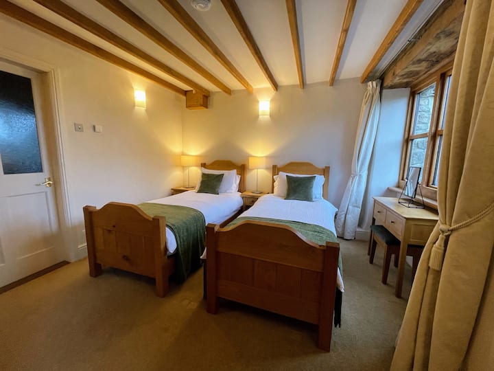 The second bedroom has two single beds that may be linked to form a super-king size bed.