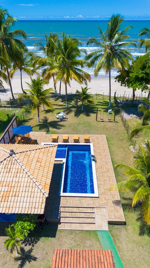 Dream pool under coconut palm, right on the beach