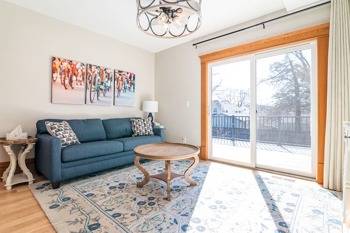 Media room opens to backyard deck, with seating for 10. Art work pays homage to RAGBRAI, an annual Iowa biking event.