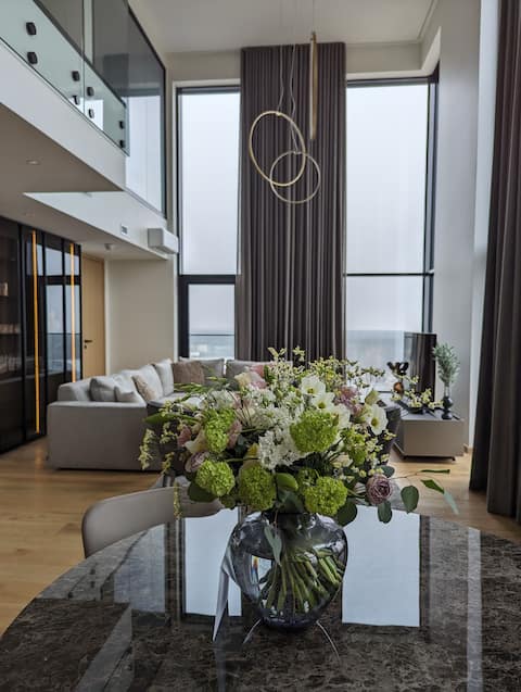 Elegant penthouse, panoramic city views & sauna.