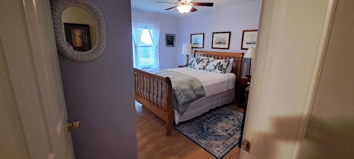 Second bedroom - queen bed. Two bright windows offer views of the horses from bed. Big closet and dresser. This room is at end of hall, with full bath with tub adjacent to left.