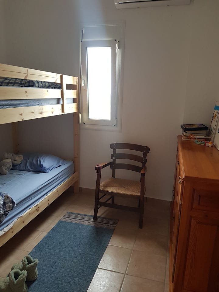 Bedroom for 2 people with bunk bed and closet space, including wardrobe (not visible in the photo).