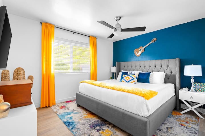 King bedroom with a Victrola music player and 43" RokuTV