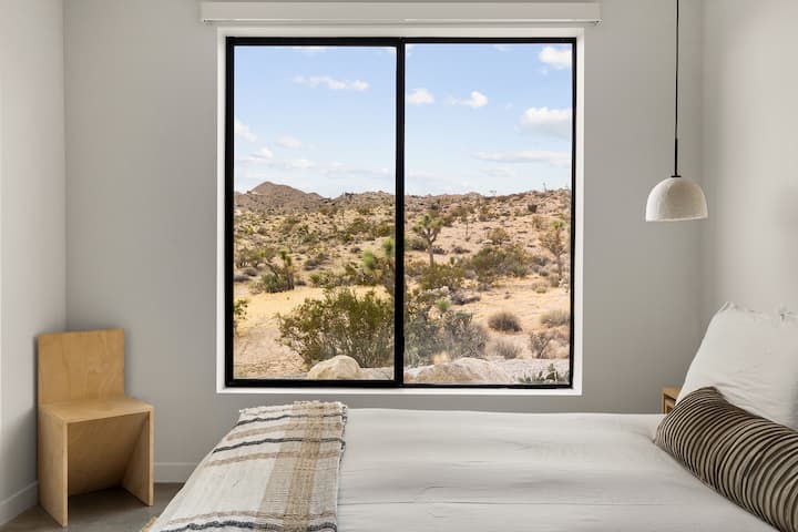 Downstairs bedroom opens up to endless, private desert views