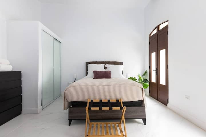 Sunlit and serene, Bedroom 2 features a comfortable queen bed and clean, modern design—an inviting retreat after exploring Old San Juan.
