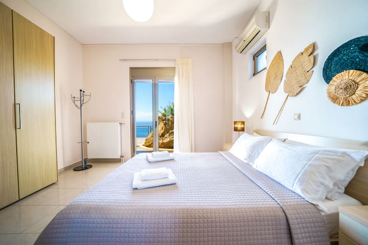 Lower Level: Bedroom 2 with queen bed and veranda access