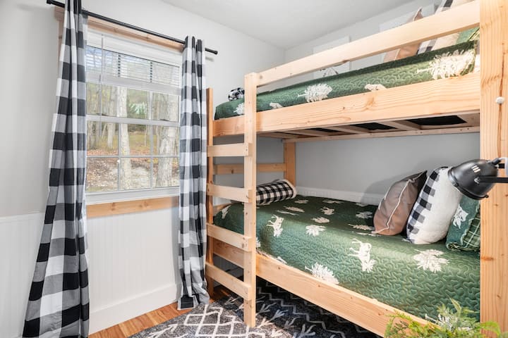 Twin bunkbed for the kiddos (or the adults) - whichever you decide. 