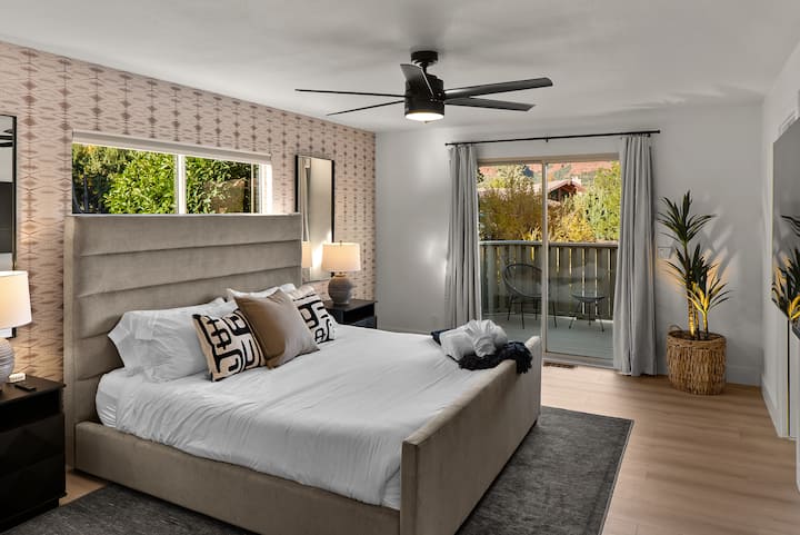 Huge primary Bedroom 1 with King bed and slider to private mini deck. Beautiful ensuite bathroom 1 as well.