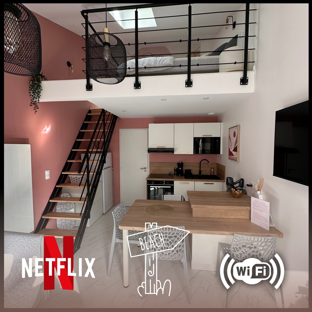 An open-plan living area is featured, showcasing a modern kitchen with a wooden counter. A staircase leads to a mezzanine bedroom above. A dining set with four chairs is positioned nearby, complemented by decorative elements on the walls and well-lit spaces.