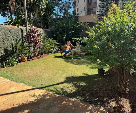 Casa da Vó Loy and its green space.