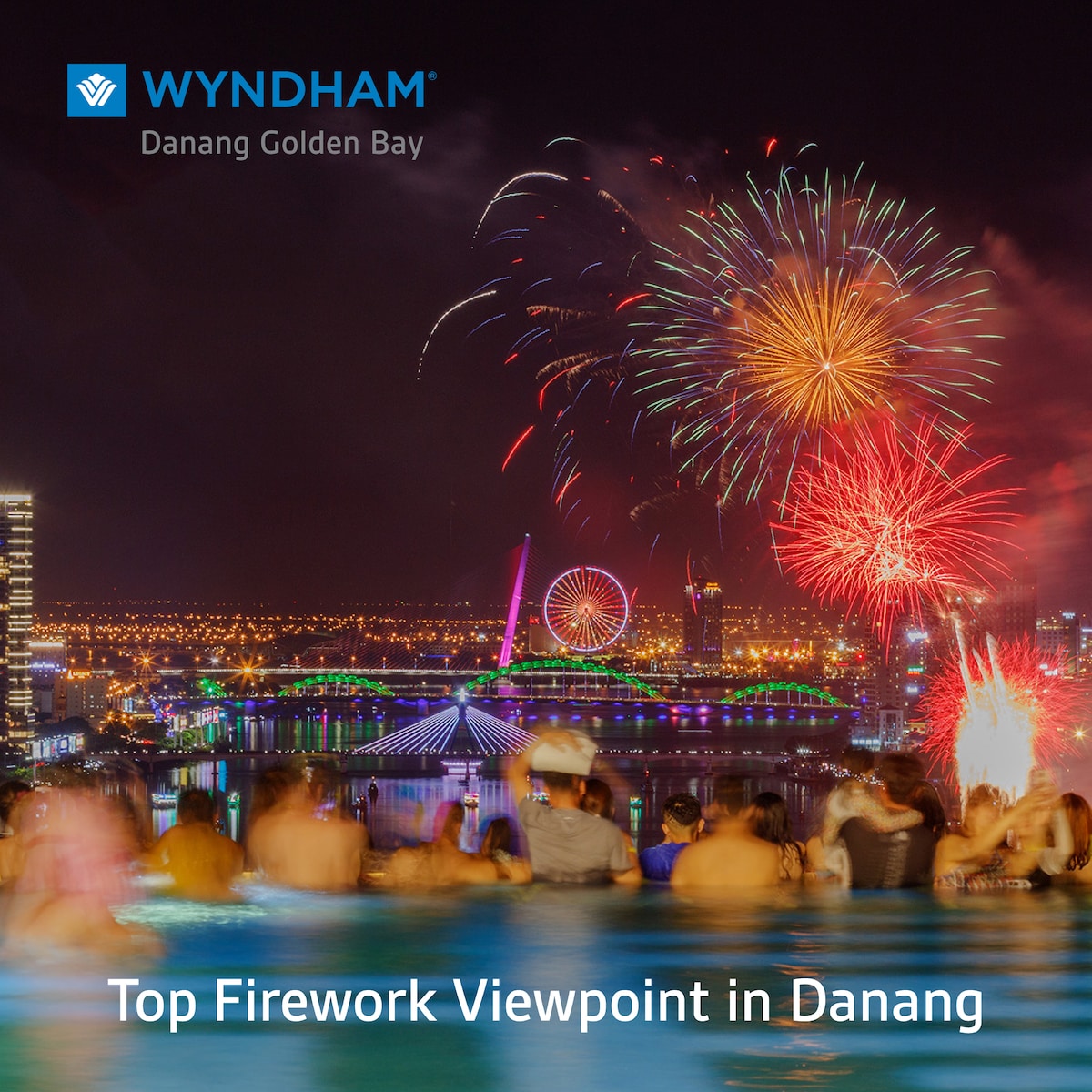 An expansive view from the rooftop shows a vibrant fireworks display over the city, with colorful bursts reflecting on the water. The horizon includes illuminated structures and attractions, while guests are seen enjoying the scene from a luxurious infinity pool.
