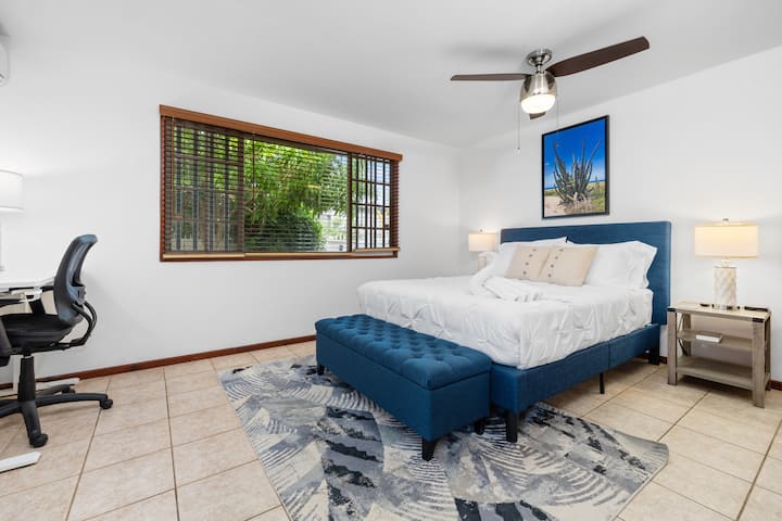 Bright and airy bedroom with workspace and queen-size bed. Ideal for guests to balance work and leisure during their island getaway.  Also large wardrobe (not pictured)