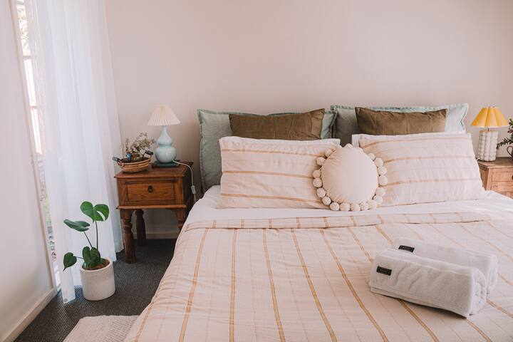 Our master bedroom featuring a comfy king size bed and of course, a newly installed split system with air con and heating