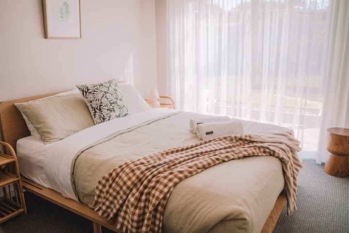 Our queen bedroom with a queen sized bed and newly installed split system with heating and cooling so you can have a comfortable night (or day's!) sleep