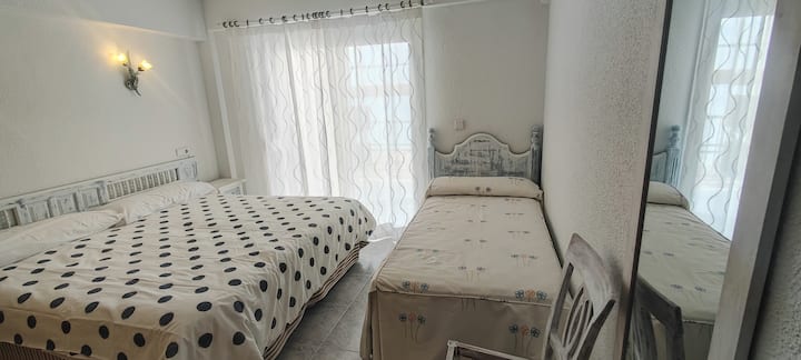 Spacious bedroom with direct access to the terrace. 1 bed of 180 cms  and 1 bed of 90 cms. Two nightstands. Wardrobe 200 cms long with hanging area and perchas, drawers and shelves. Full Length Length Mirror Mirror