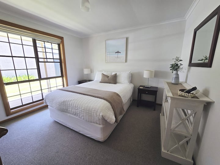 2nd Queen bedroom with electric blanket. Stand for hanging clothes and storage.